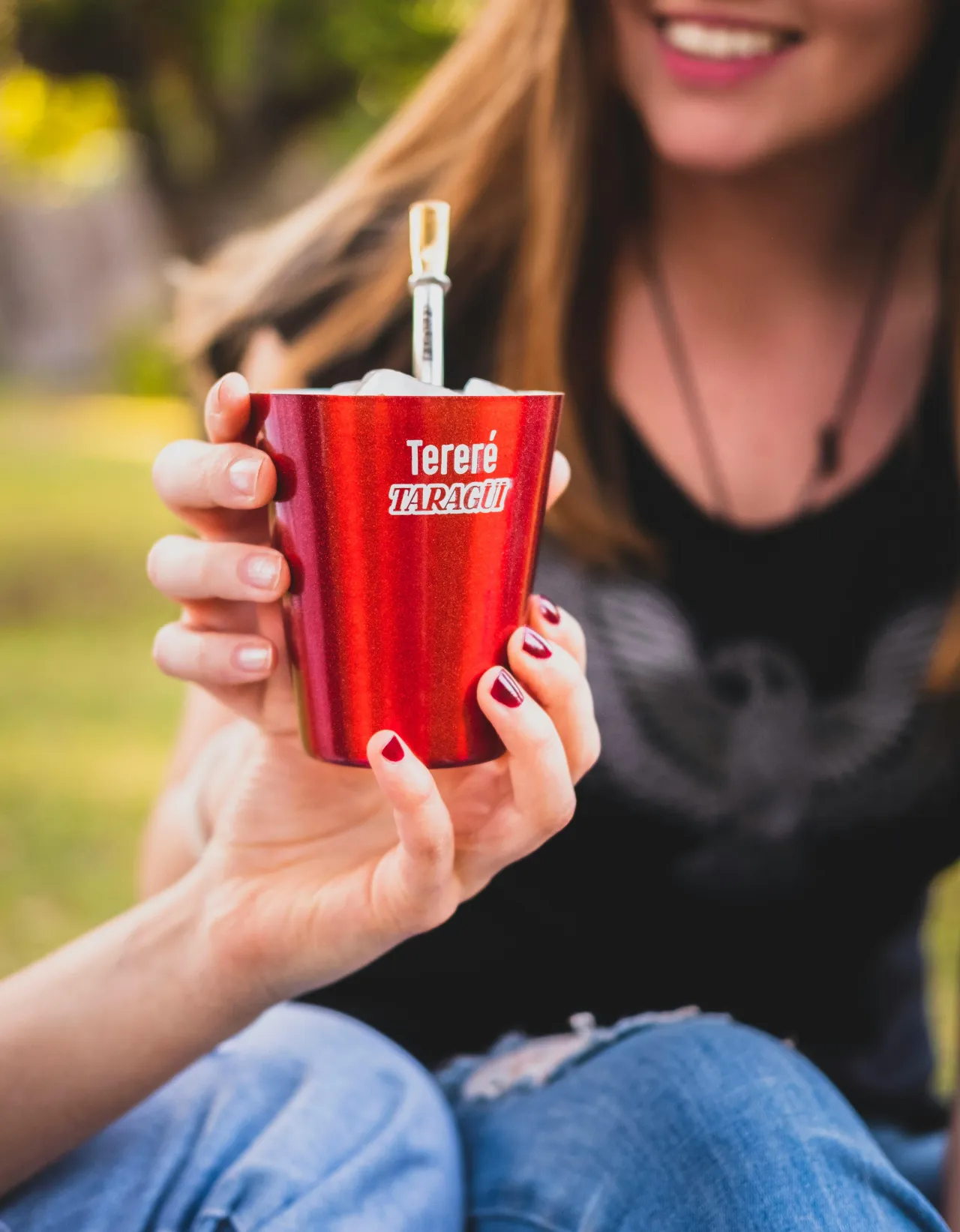 Woman grabbing a mate cup